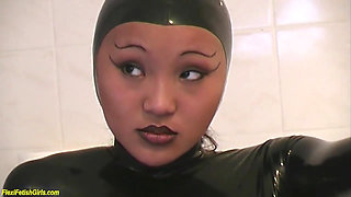 Cute young asian latex teen stretching her flexi body