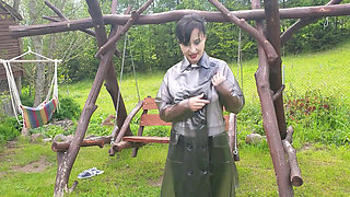 Raincoat, nylons and bra with open nipples