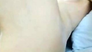 Cute amateur teen girl toying her pussy in bed on cam