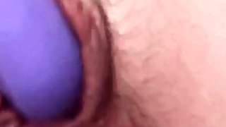 Play with my pussy with my purple vibrator