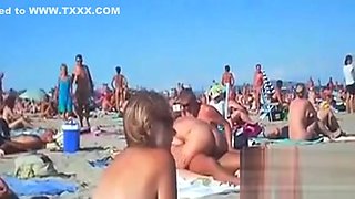Swingers Having Fun Outdoors At A Beach
