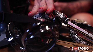 Kitt Jones gets so horny in her bunker she uses a powerful machine on her pussy! - AltErotic