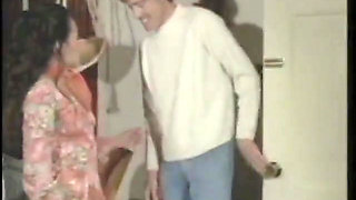 Vintage porn: John Holmes and his huge cock fucking a hot woman in black stockings