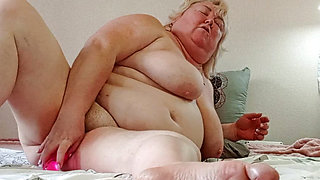 Mother-in-law stripped naked and masturbates her holes with a toy in front of the camera
