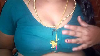 Tamil aunty squeezing her breasts when she is alone and unable to control her emotions.