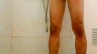 I was taking a shower while masturbating suddenly my man came in and looked at my whole body