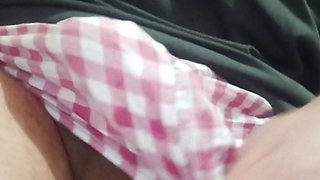 Young man touching himself while taking out eggs