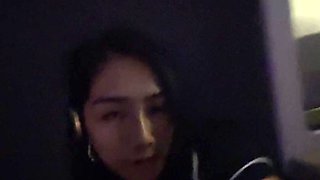 Business-class flight flashing by a petite rich Asian girl