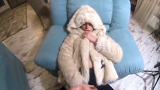 Face stuffed while rocking a white fur coat and Uggs