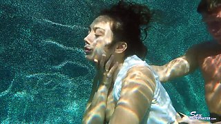Beautiful coquette fucks under water