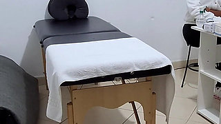 A MILF Gets Fingered by the Proctologist During an Anal Exam.