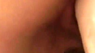 Brunette plays with dildo