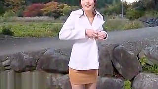 Japanese beauty gives blowjob outdoor