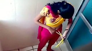 Some amateur Indian brunette gals peeing in the toilet on voyeur cam