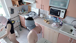 An amateur couple is having fun in the kitchen.