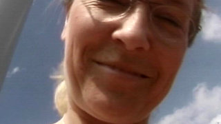 Mature Blonde Masturbates in a Field