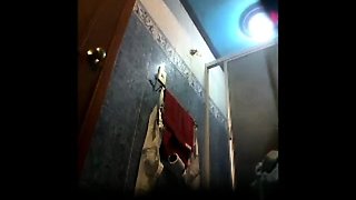 Desi aunty caught on hidden cam placed in bathroom