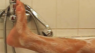 Big boobed German slut enjoys solo action in the shower