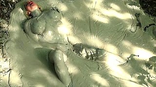Outdoor solo masturbation scene with curly blonde