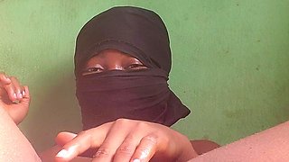 Naughty African babe touching and fingering herself when she is  alone