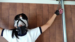 A Girl Is Left Alone for a Long Time with a Gag Mask and Crucifixion Restraints