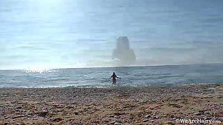 Hairy chick Riana S makes a splash at the beach - WeAreHairy