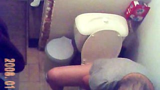 Horny granny gets caught on tape by me when peeing in the toilet room