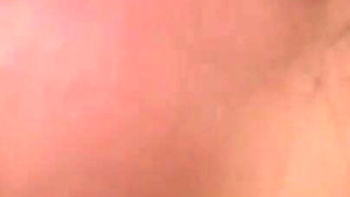 Horny brunette loves a warm load on her tits in close up