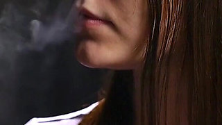 18 Aged Girl Is Smoking Two Strong Cork Cigarettes