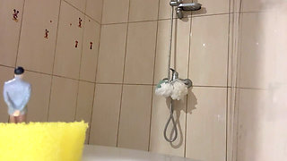 The Giant Stepsister Undresses and Prepares to Take a Shower, but She Doesn't Suspect That the Tiny Stepbrother Is Watch