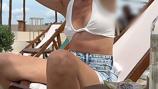 Drinking coffee at the beach bar in a sexy see through top