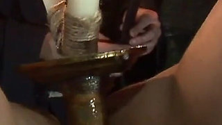 Witch Hangs Upside Down and Gets Drizzled with Black Wax