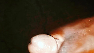 An African guy rubbing his big dick inside his room