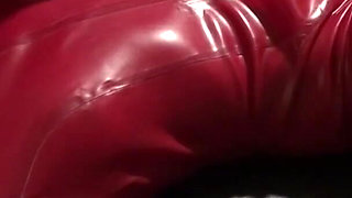 Latex Danielle in catsuit has latex masturbating games with her slave