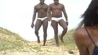Hot mulatto with a big tail moaning and cumming, giving her pussy and spitting on the beach to two black guys: Porn