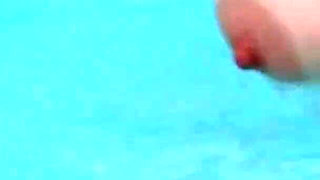 Curly-haired Babe Masturbates with Bottle in Hot Tub