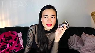 Merciless Oriental femdom vixen eager to punish caged cock