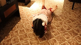 A Cute Little Dressed in a Jk Uniform Was Walking Around Barefoot on the Ground.