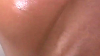 Busty ebony milf gets oiled and fucked
