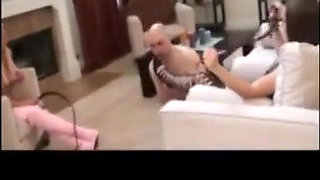 Bootslave must clean black and pink boots of the ladies!