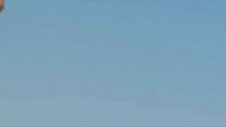 Stunning Brunette Babe Strips Naked on Rocky Beach Adventure