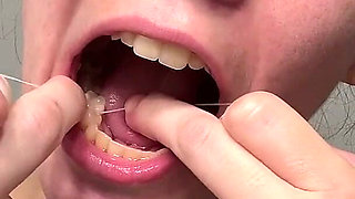 Flossing Teeth with Oral B Glide Dental Floss