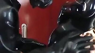 Latex Rubber Petting- Curvy MILF and Her Submissive Guy - Polishing Oiling and Petting in the Plane