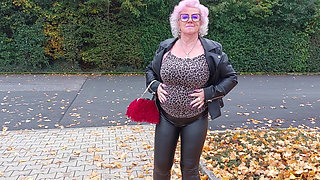 Naughty Granny Tongue Out Flashing Big Tits in Public