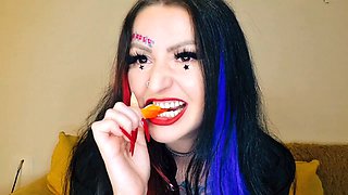 Dominatrix Nika indulges in her food fetish by chewing gummies