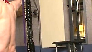 The blond woman humiliates and spanks on the masked guy