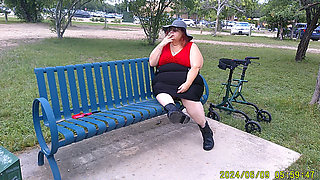 Nurse Vicki Smoking in the Park on a Bench All Dressed up