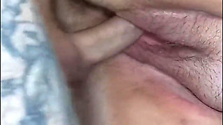 Big hairy pussy close-up gets a bigger cumshot