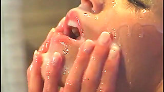 Naked blonde masturbates in hot pool while man with pantyhose on his head watches