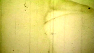 Worn Sepia Loop Captures Curly Retro Couple in Raw Bedroom Passion